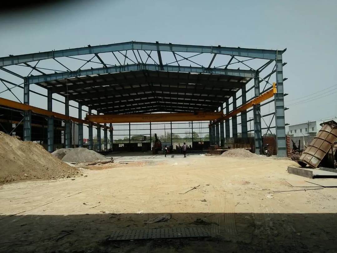 Wide view of a steel portal frame under erection